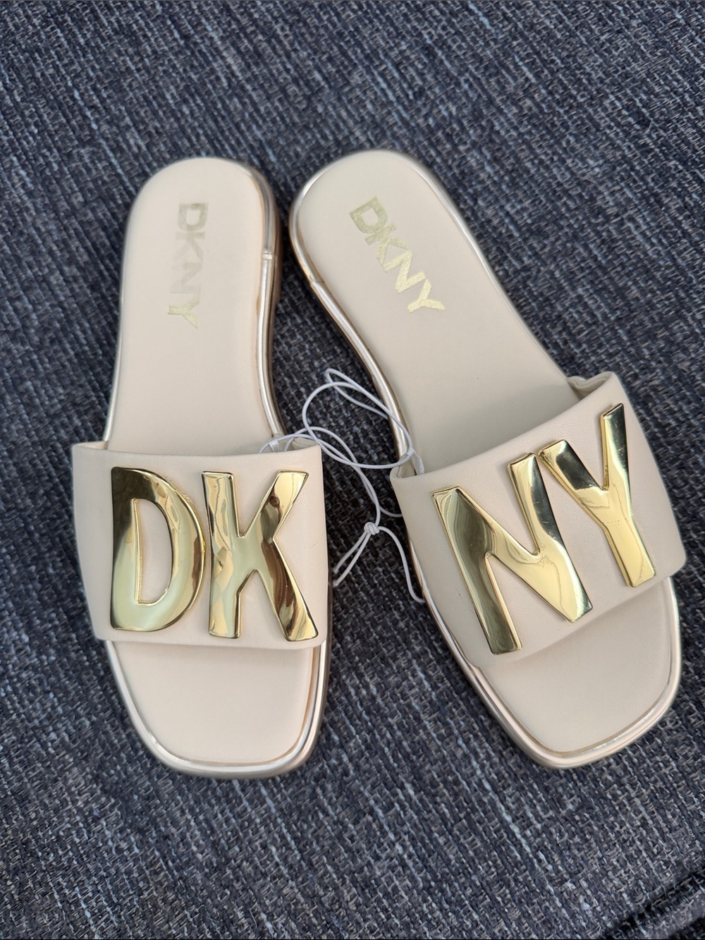 DKNY Cream Slide Sandals with Gold Logo Plaques